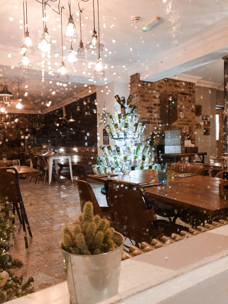 Christmas restaurant photo with wine bottle tree
